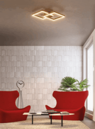 Stropné LED svietidlo REDO Lighting v modernom interiéri s červenými kreslami